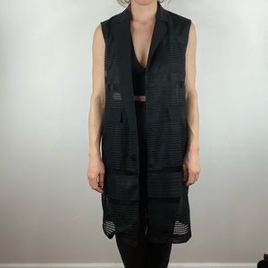 Black sleeveless duster